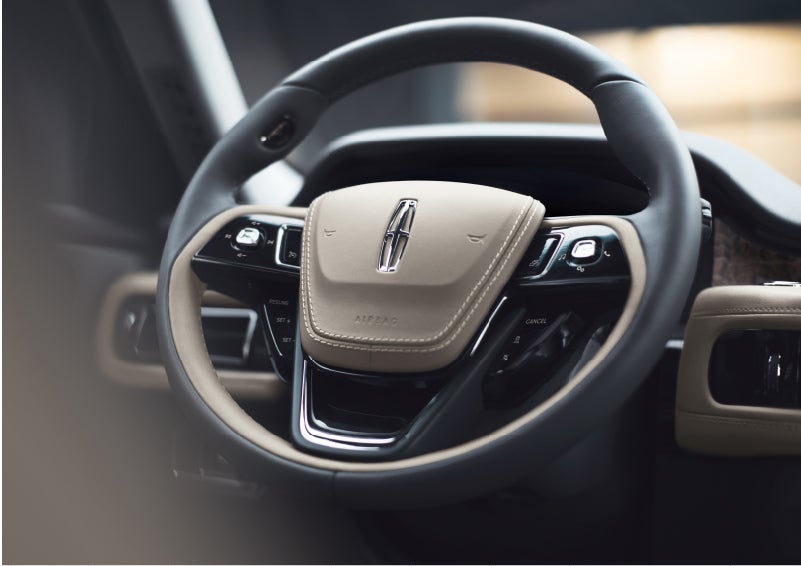 The intuitively placed controls of the steering wheel on a 2023 Lincoln Aviator® SUV | Zeigler Lincoln of Kalamazoo in Kalamazoo MI