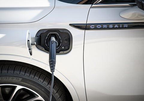 A 2023 Lincoln Corsair® Grand Touring model is shown being charged via the driver’s side charging port. | Zeigler Lincoln of Kalamazoo in Kalamazoo MI