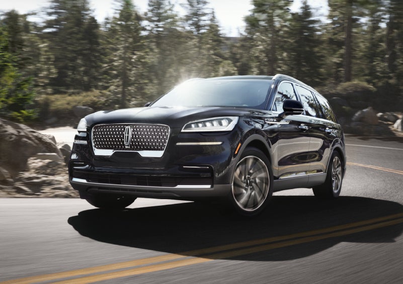 A Lincoln Aviator® SUV is being driven on a winding mountain road | Zeigler Lincoln of Kalamazoo in Kalamazoo MI
