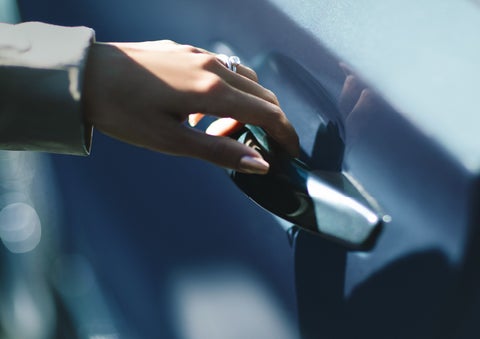 A hand gracefully grips the Light Touch Handle of a 2024 Lincoln Aviator® SUV to demonstrate its ease of use | Zeigler Lincoln of Kalamazoo in Kalamazoo MI