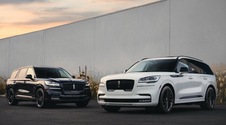 Two Lincoln Aviator® SUVs are shown with the available Jet Appearance Package | Zeigler Lincoln of Kalamazoo in Kalamazoo MI