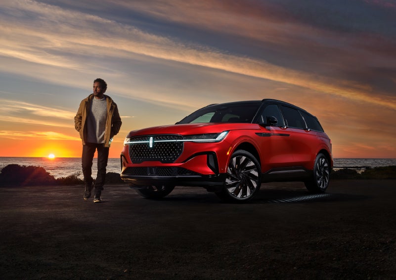 A person is shown next to a 2024 Lincoln Nautilus® SUV as the Lincoln Embrace sequence takes place. | Zeigler Lincoln of Kalamazoo in Kalamazoo MI