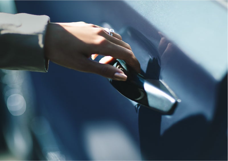A hand gracefully grips the Light Touch Handle of a 2023 Lincoln Aviator® SUV to demonstrate its ease of use | Zeigler Lincoln of Kalamazoo in Kalamazoo MI