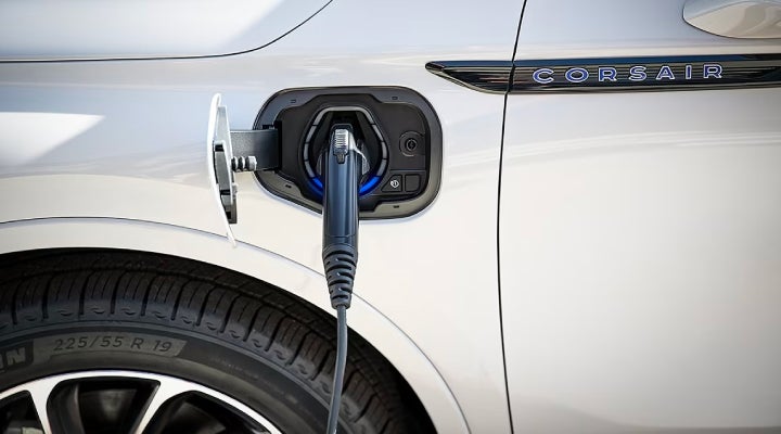 An electric charger is shown plugged into the charging port of a Lincoln Corsair® Grand Touring
model. | Zeigler Lincoln of Kalamazoo in Kalamazoo MI