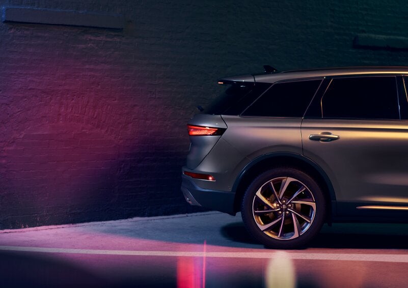 A dramatization of a 2025 Lincoln Corsair® SUV is shown backing up toward a wall. | Zeigler Lincoln of Kalamazoo in Kalamazoo MI