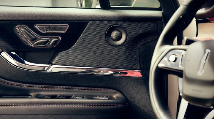 A Revel® audio speaker is shown in the driver's side door of a 2025 Lincoln Corsair® SUV. | Zeigler Lincoln of Kalamazoo in Kalamazoo MI