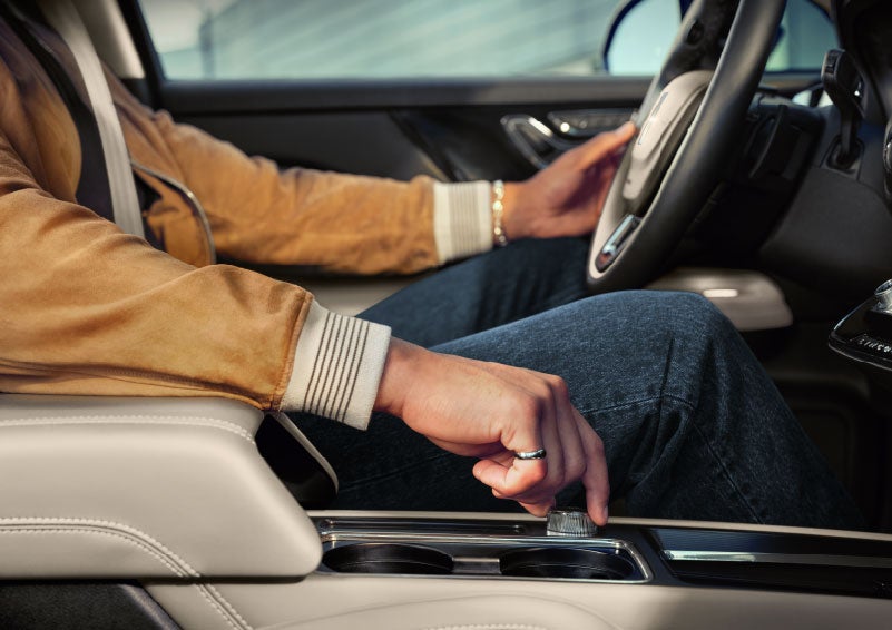 The driver of a 2024 Lincoln Corsair® SUV is shown selecting the drive mode. | Zeigler Lincoln of Kalamazoo in Kalamazoo MI