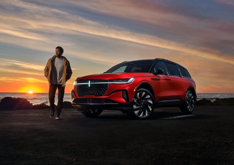 A person is shown next to a 2025 Lincoln Nautilus® SUV as the Lincoln Embrace sequence takes place. | Zeigler Lincoln of Kalamazoo in Kalamazoo MI