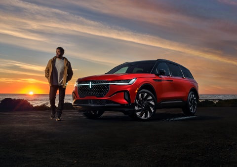 A person is shown next to a 2025 Lincoln Nautilus® SUV as the Lincoln Embrace sequence takes place. | Zeigler Lincoln of Kalamazoo in Kalamazoo MI