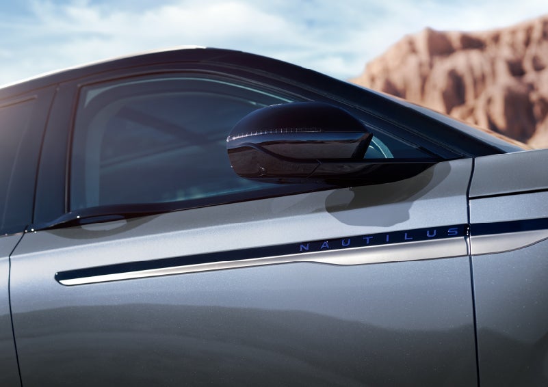 Blue lettering on the side of the vehicle that reads nautilus indicates the available hybrid powertrain. | Zeigler Lincoln of Kalamazoo in Kalamazoo MI