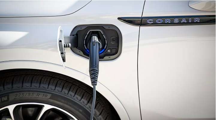 An electric charger is shown plugged into the charging port of a Lincoln Corsair® Grand Touring
model. | Zeigler Lincoln of Kalamazoo in Kalamazoo MI