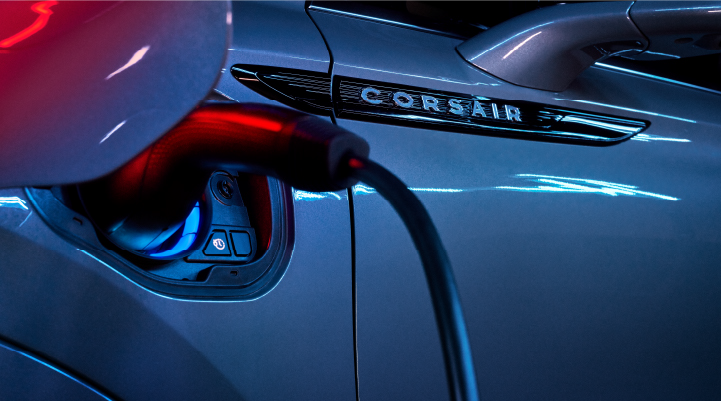 A charger plugged into the charging port of a 2025 Lincoln Corsair® Plug-in Hybrid model. | Zeigler Lincoln of Kalamazoo in Kalamazoo MI