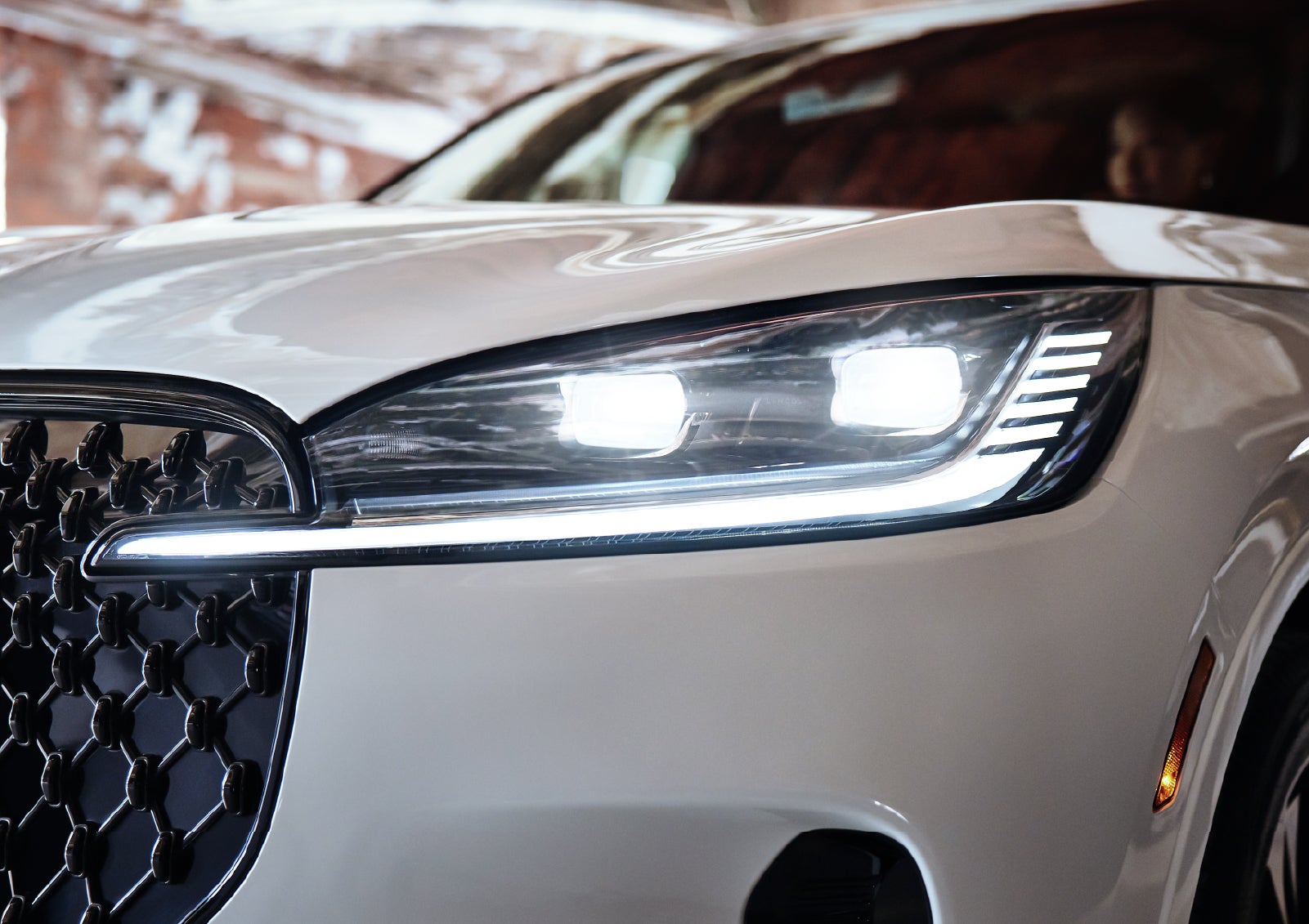 A close-up of a headlamp on the 2027 Lincoln Aviator® SUV is shown. | Zeigler Lincoln of Kalamazoo in Kalamazoo MI