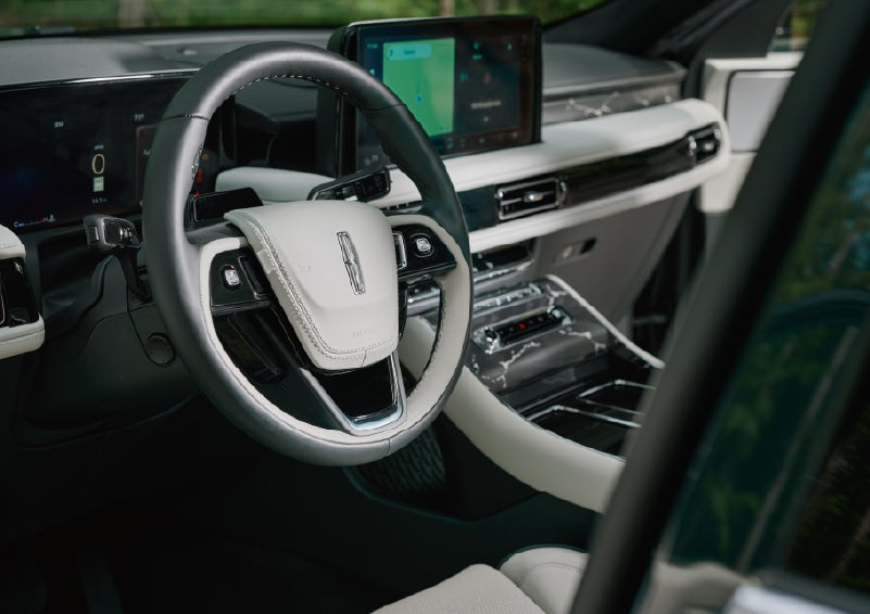 The leather-trimmed steering wheel of a 2027 Lincoln Aviator® Black Label™ SUV. | Zeigler Lincoln of Kalamazoo in Kalamazoo MI