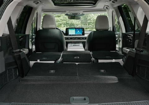A rear to front view of the interior of a 2027 Lincoln Aviator® Black Label™ SUV shows the third and second rows folded flat | Zeigler Lincoln of Kalamazoo in Kalamazoo MI