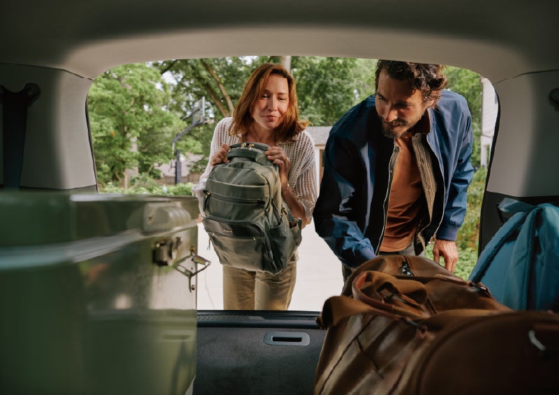 A couple loads luggage into the rear of a 2027 Lincoln Aviator® Black Label™ SUV..e 202 | Zeigler Lincoln of Kalamazoo in Kalamazoo MI